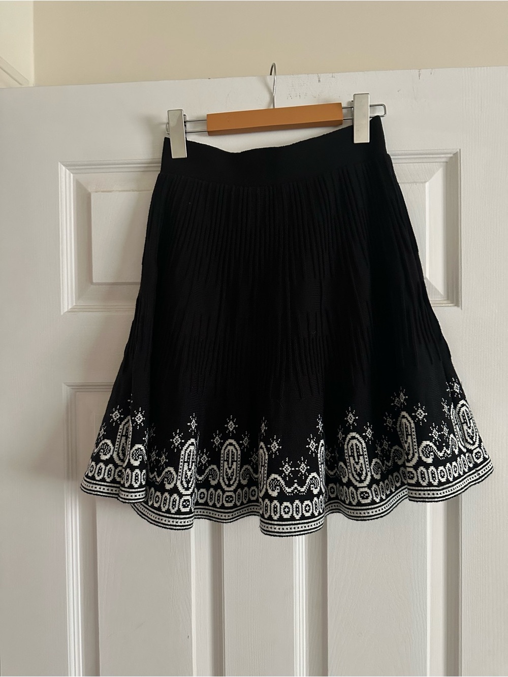 Black knee length knit skirt with white detail